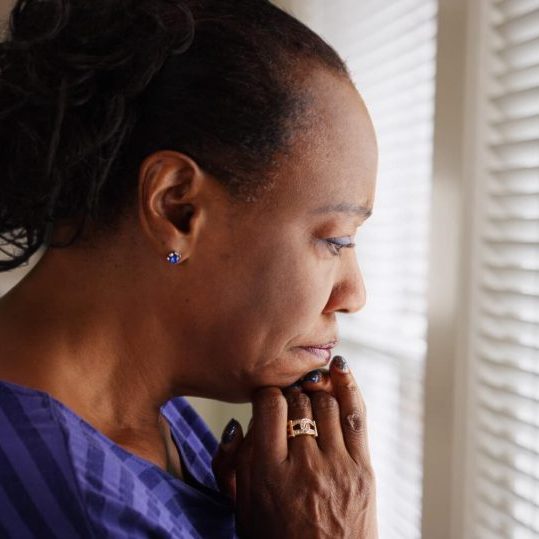 A woman with a troubled expression.